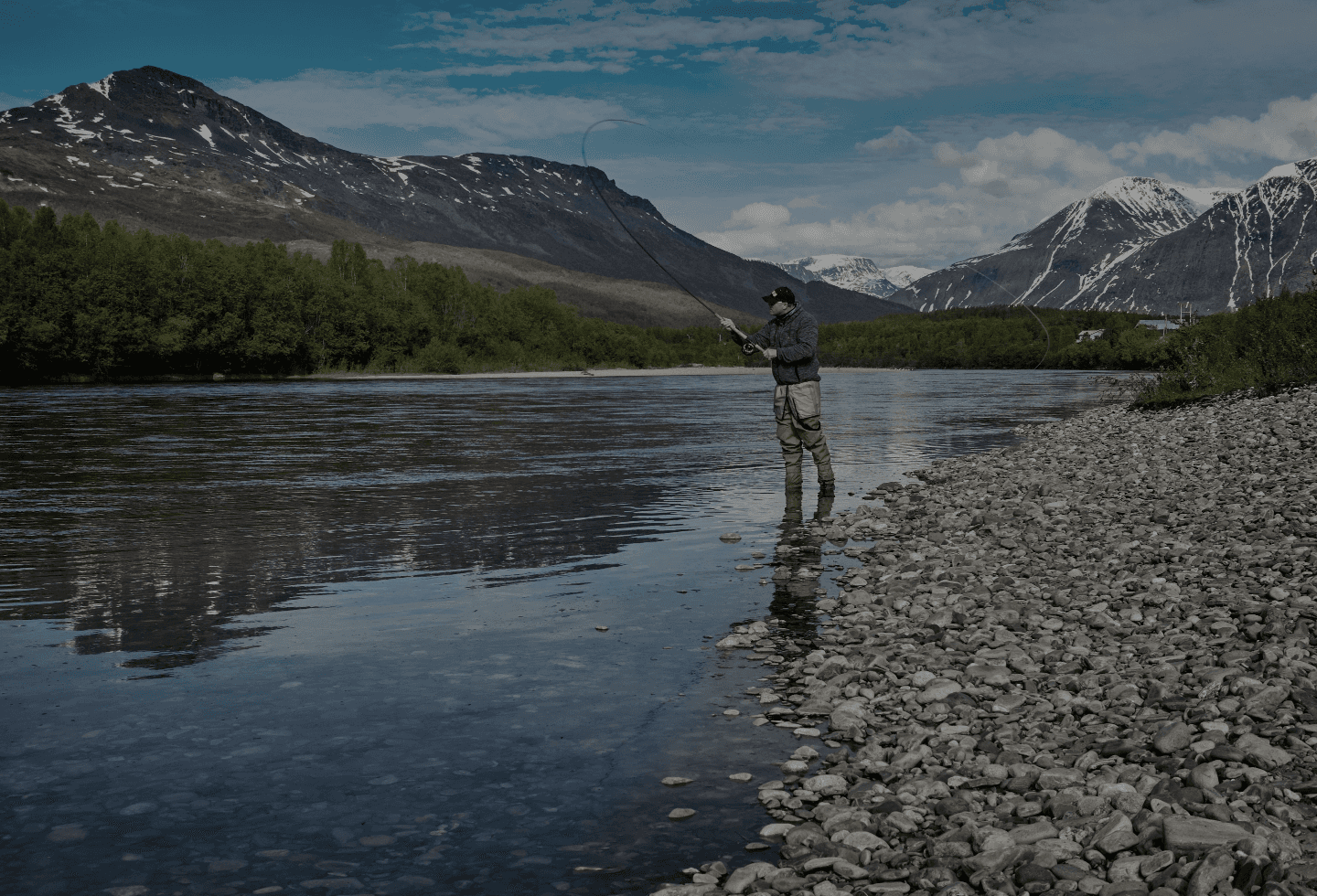 man fishing on the river