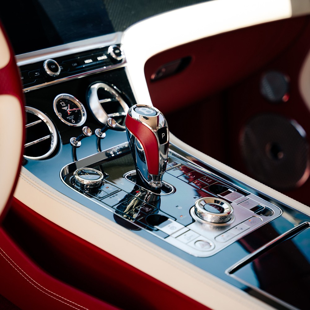 Bentley GT center console with red gear shifter and polished metal trim