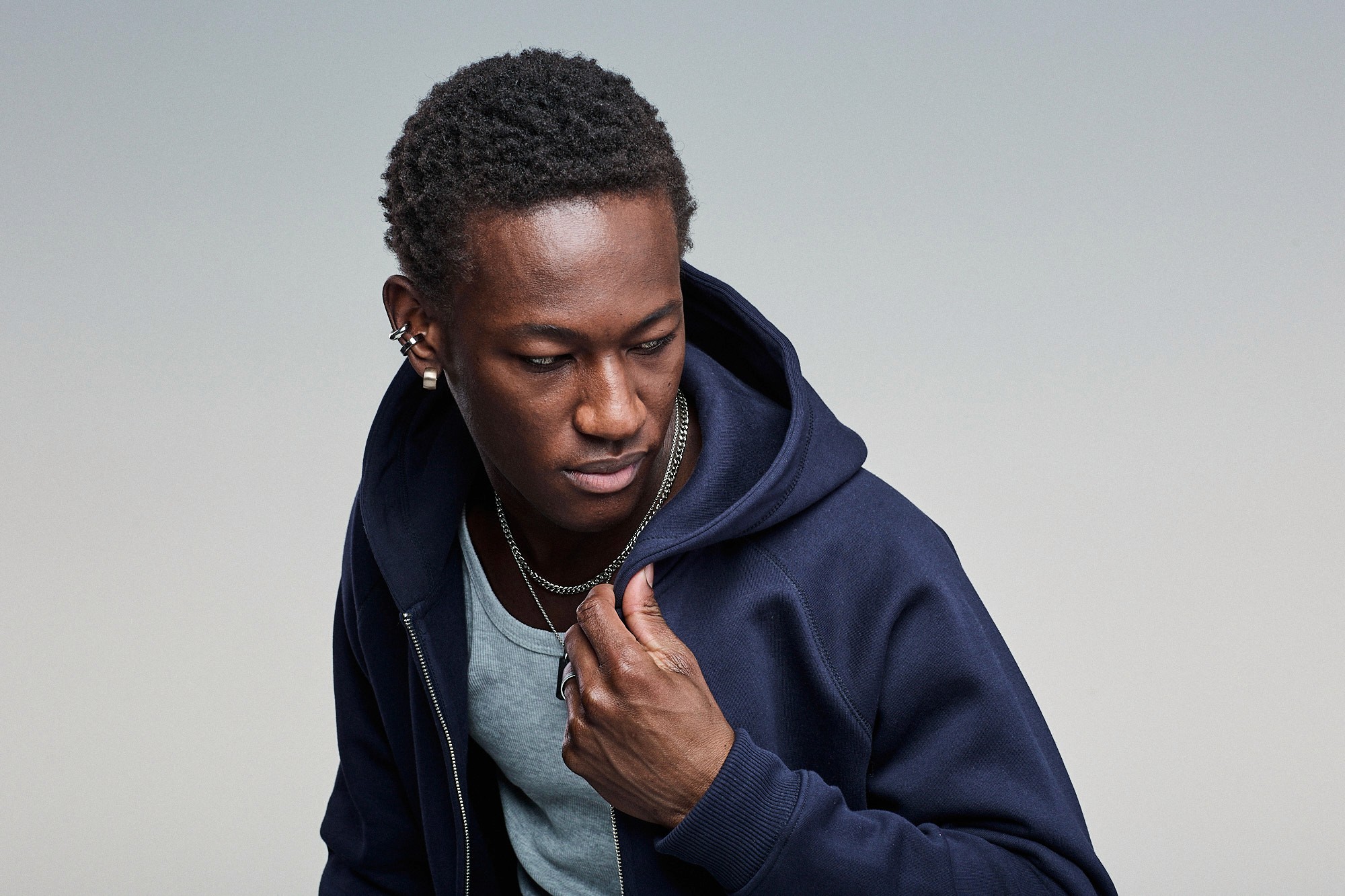 Person wearing navy Sunday Superior Ziphood