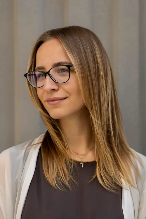  Photo of Anastasiia, Founder and RCIC, looking at the right of the camera