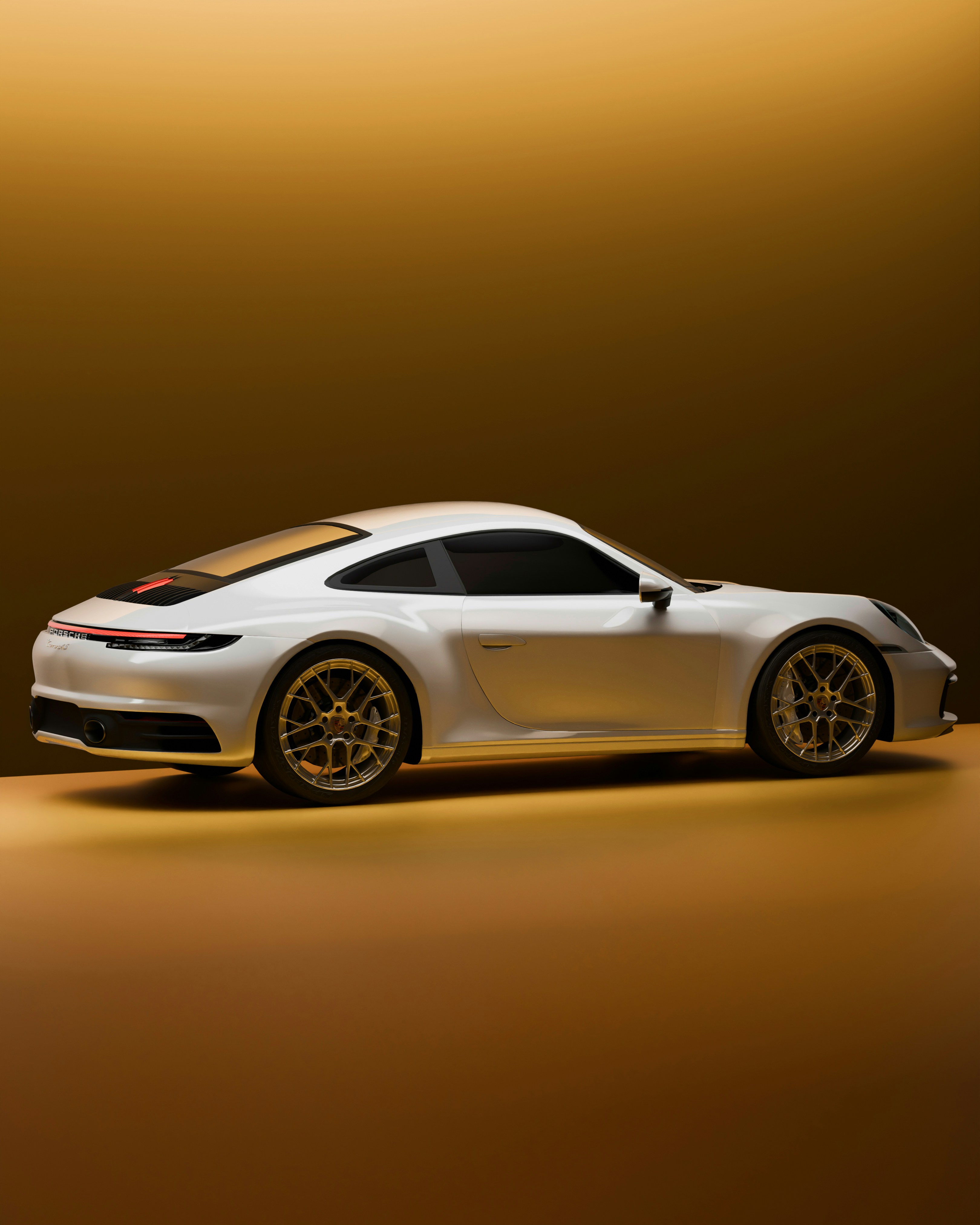 White sports car parked on a golden surface
