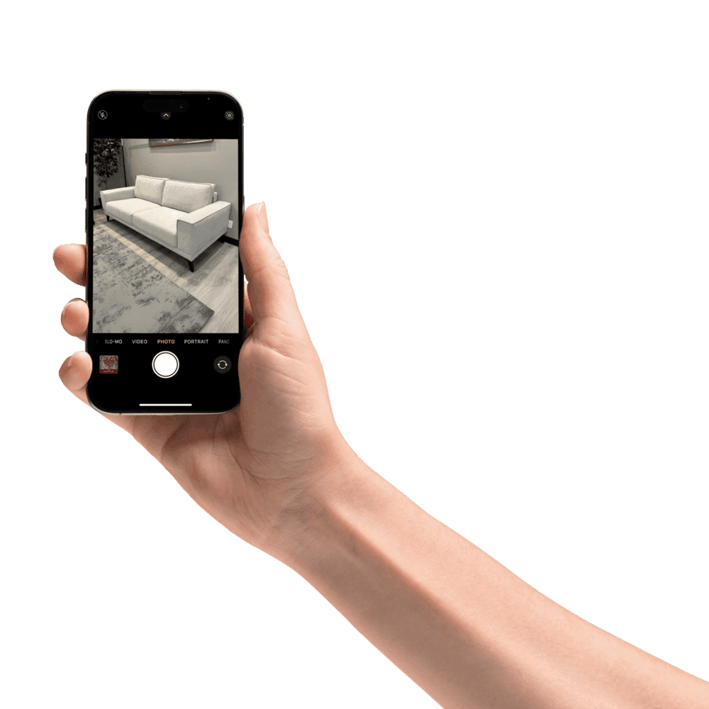 A hand holding a black pen, poised to write or draw on a surface.