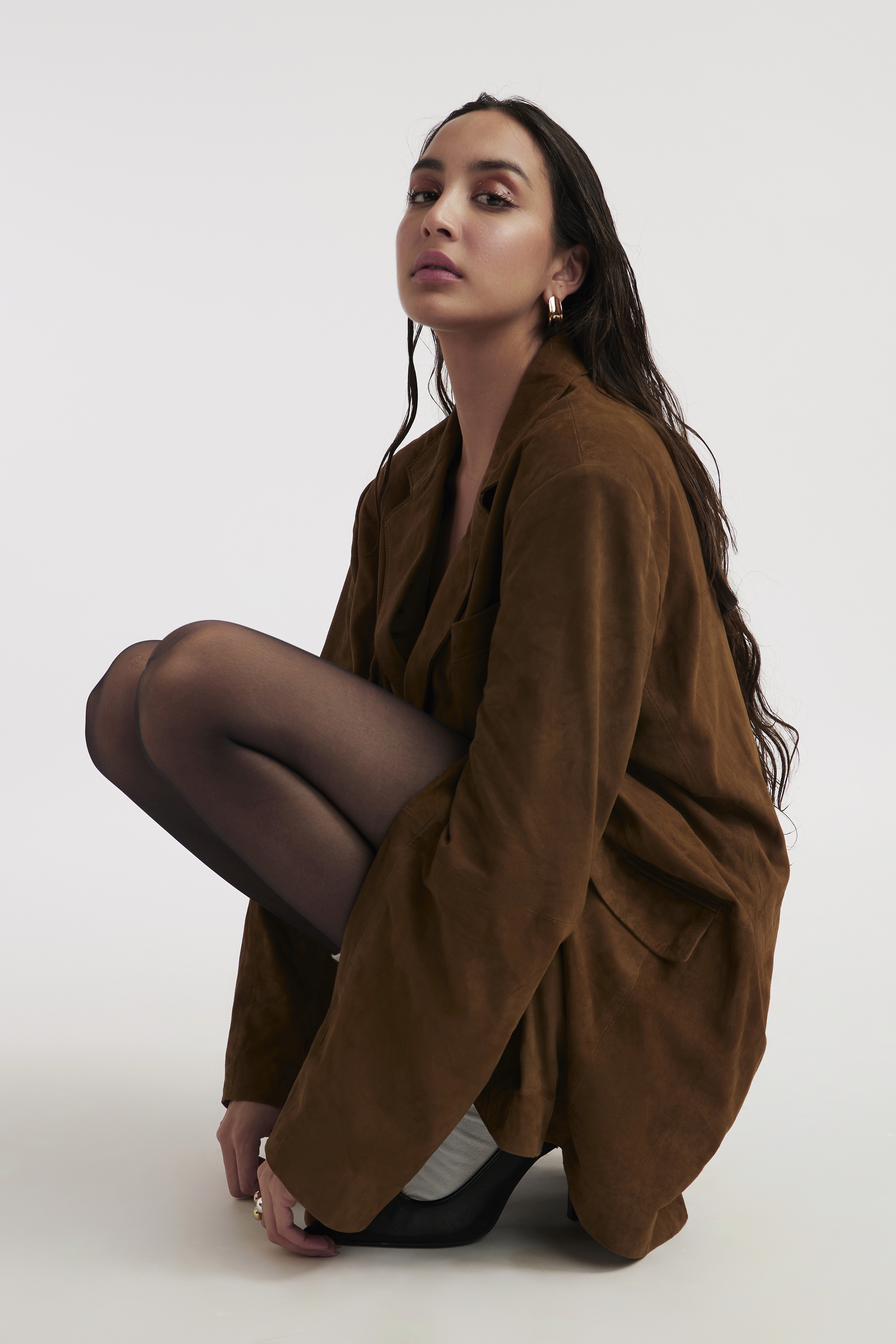 Friends laughing and posing inside a car