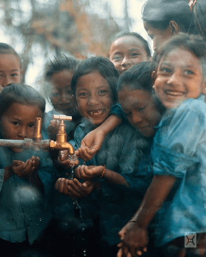 Photo of 5 children at a water source