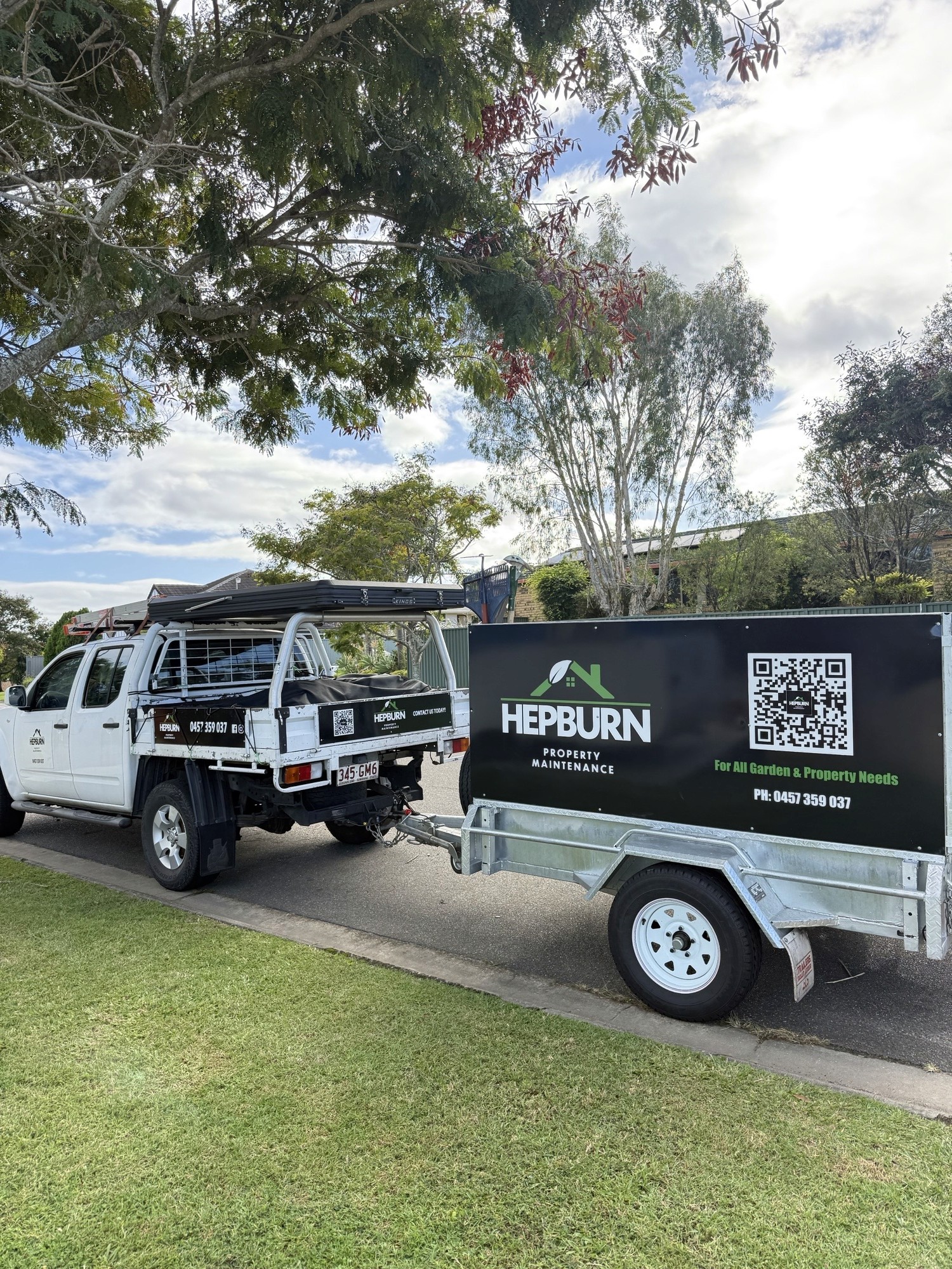 Hepburn Property Maintenance team mowing and whipper snipping residential lawn Gold Coast