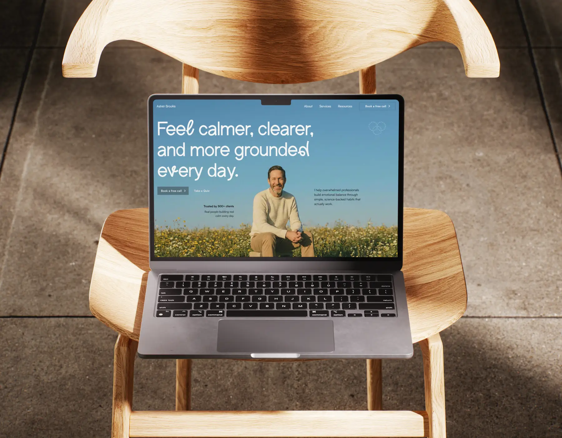 Laptop showing asher brooks landing page website