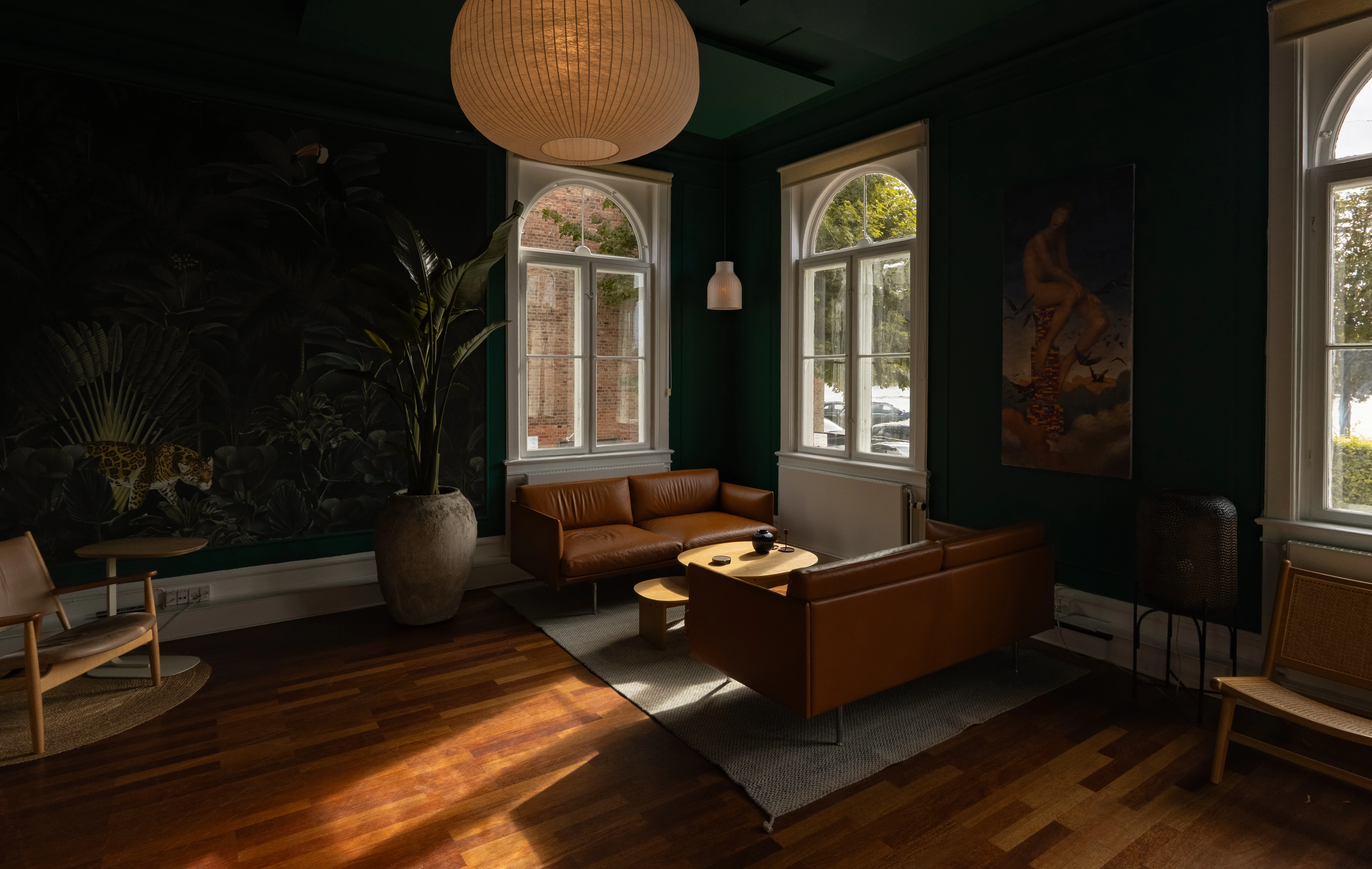 A fast black sports car races down the highway.