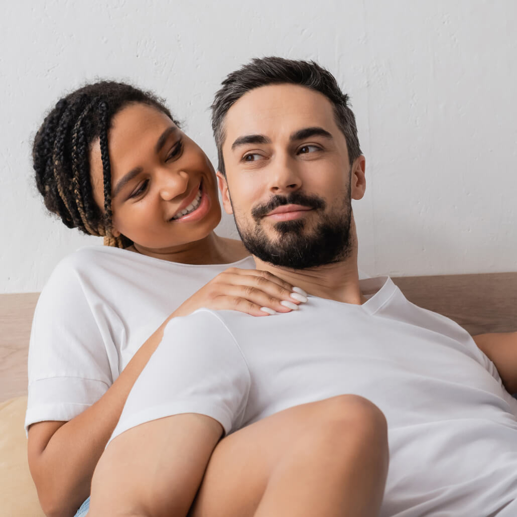Couple sitting on couch together.