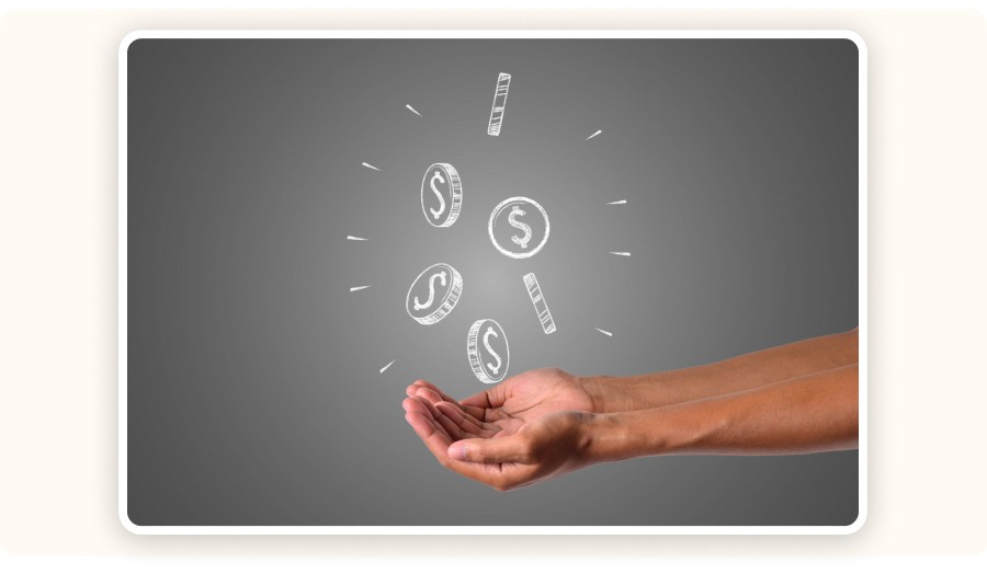 Hands holding floating coins symbolizing financial growth and profit