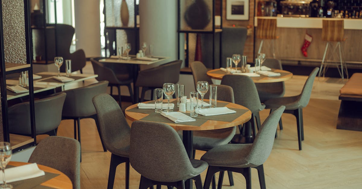 Warm and inviting modern restaurant setting with neatly arranged tables and chairs.