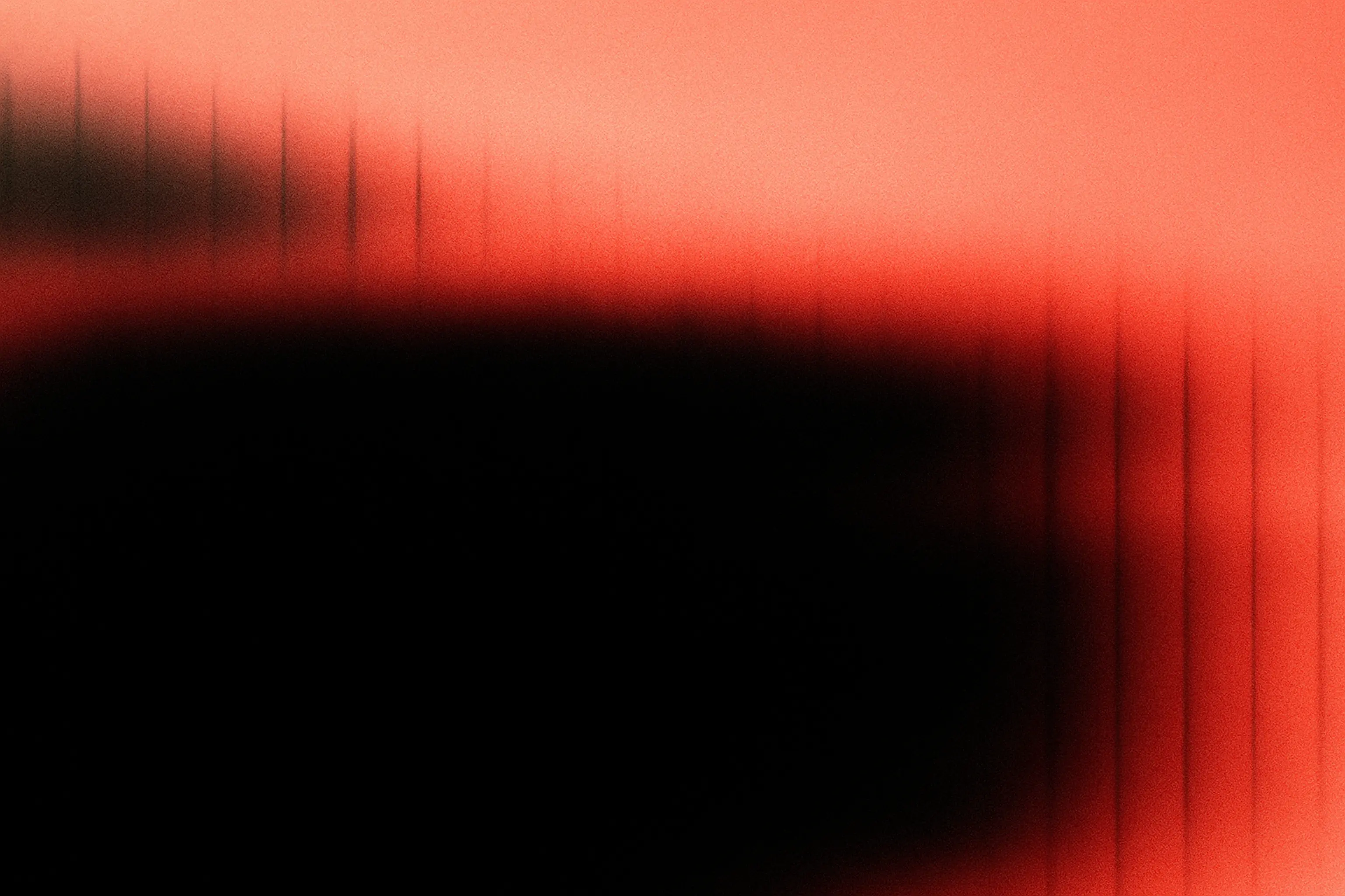 Abstract red flowers with glowing highlights and soft light particles on a dark background.