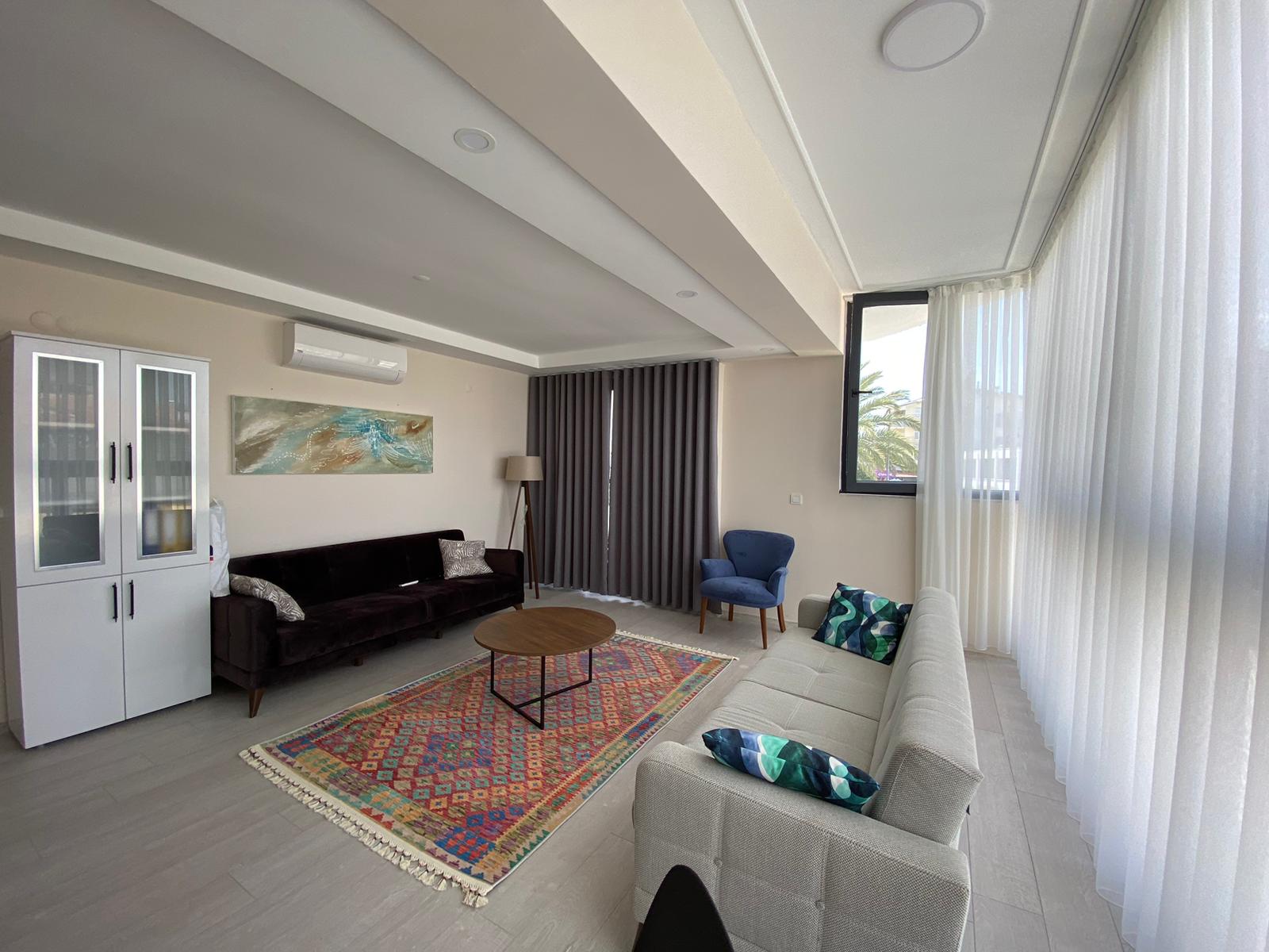 1+1 apartment living room interior at Zen Garden Suites Side Antalya