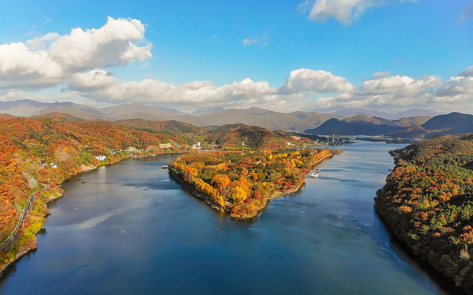 Aerial view of Nami Island in half-moon shape surrounded by autumn foliage, South Korea.