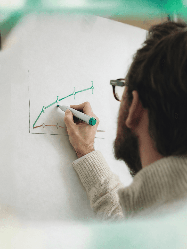 Glowing red biological cells seen under a microscope, suggesting cellular or molecular research imagery.