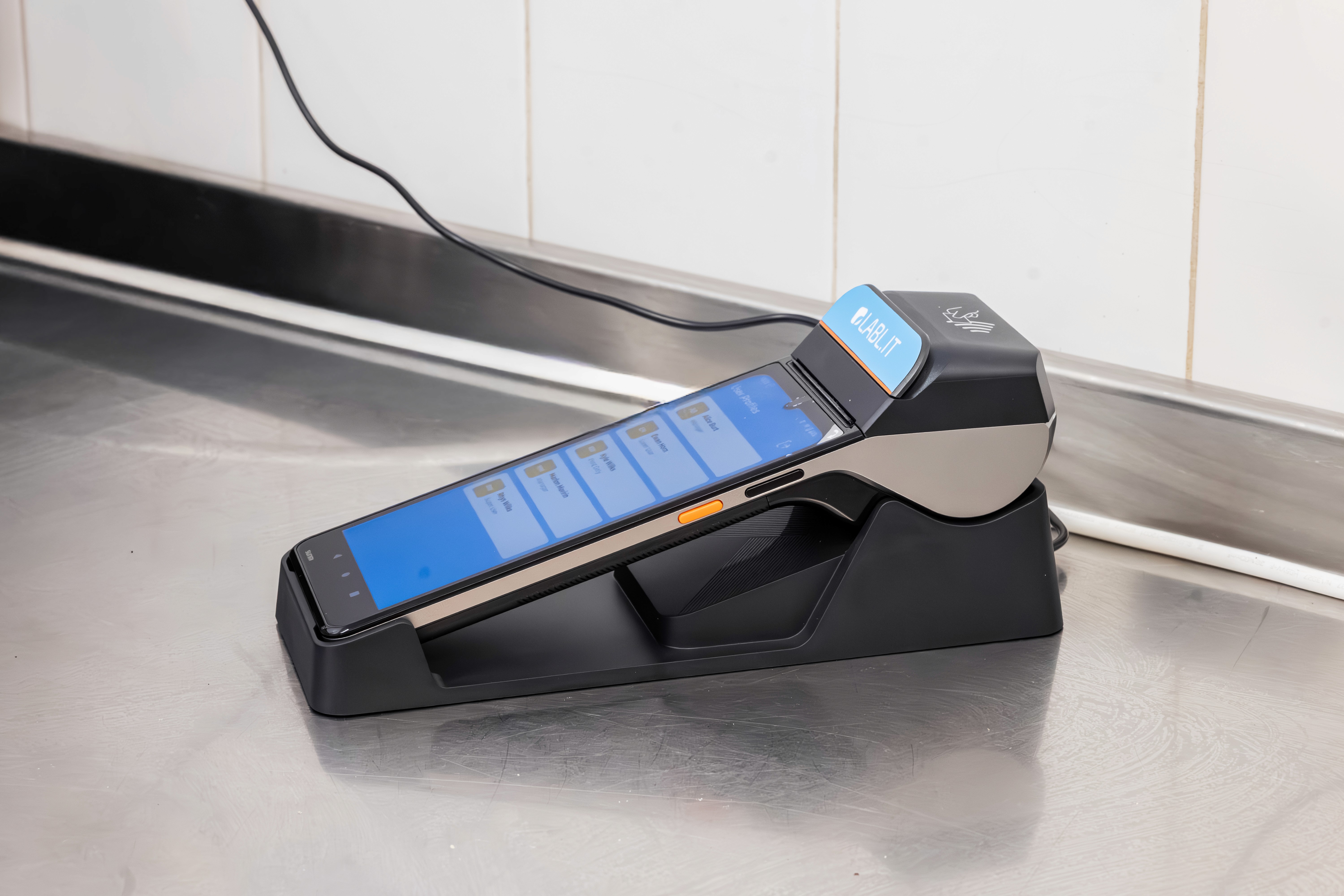 Labl.it device in a commercial kitchen on a charging cradle