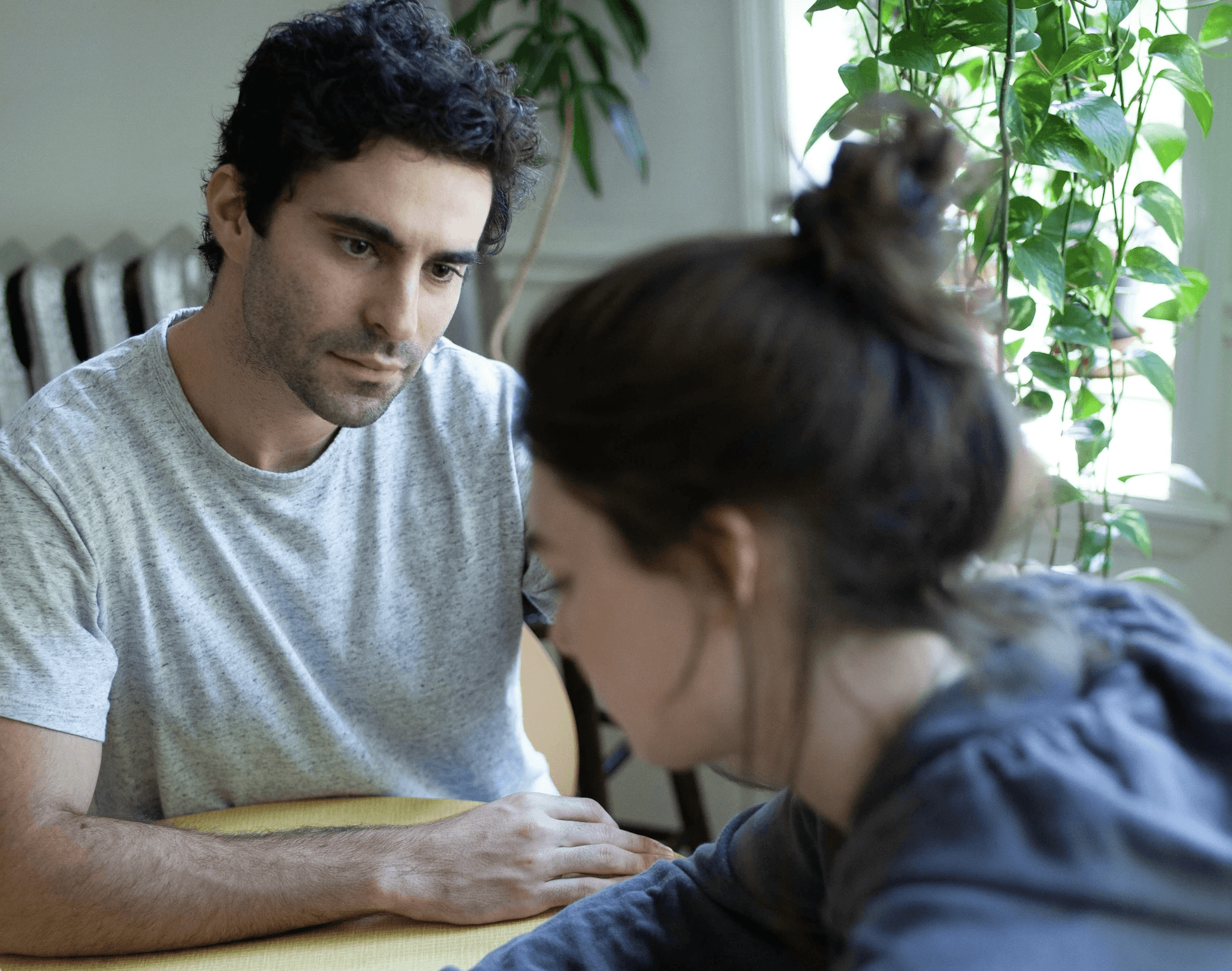 man and woman sitting at a table