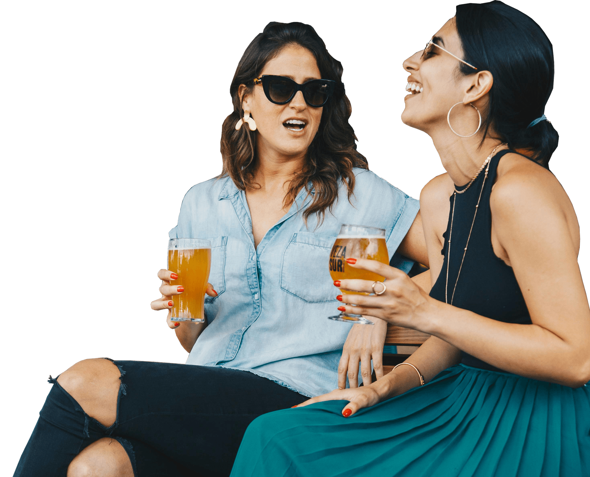 Two women enjoying drinks outdoors, symbolizing approved alcohol licensing with Barnab.