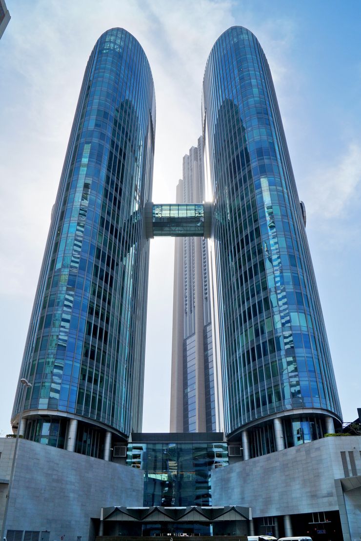Modern office space for rent in Emirates Financial Towers with glass skybridge.