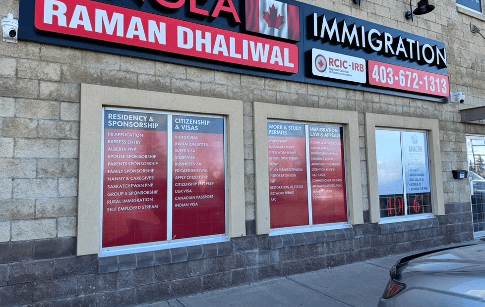 Custom storefront window graphics installed for a Calgary business by DisplayWorks Signs & Graphics.