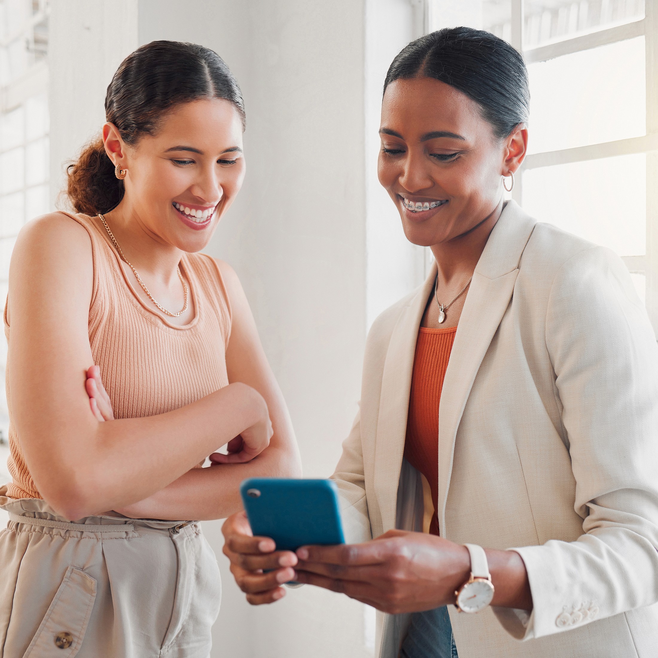 two persons looking at the phone screen