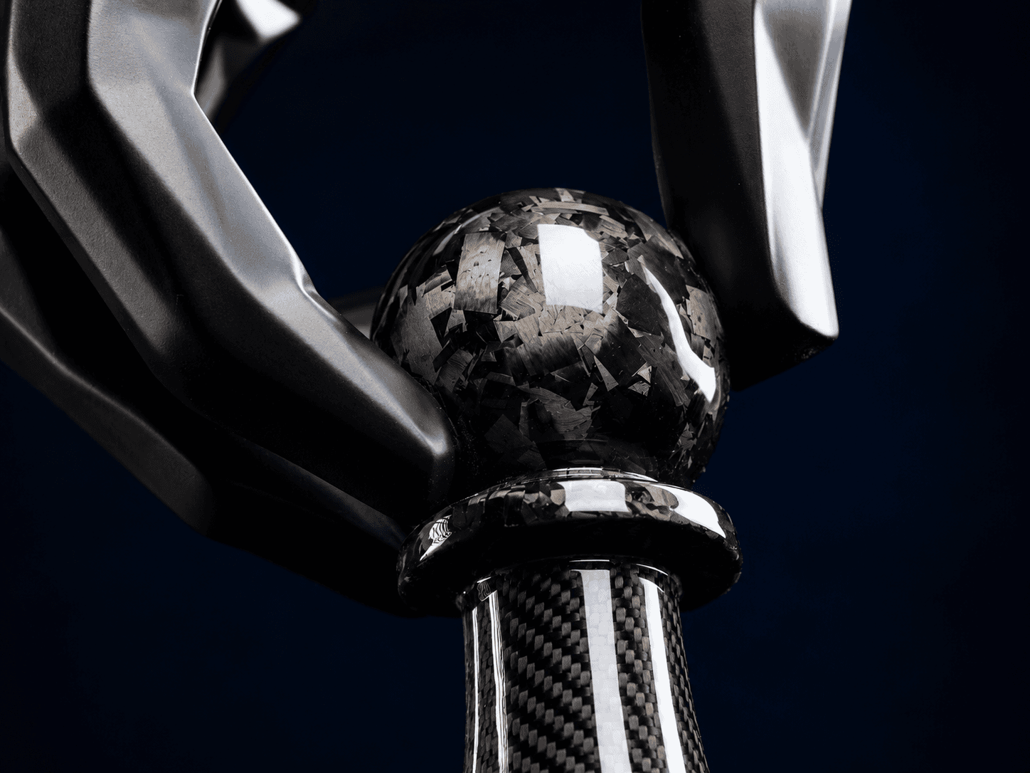 Close-up of sculpture hand and sphere