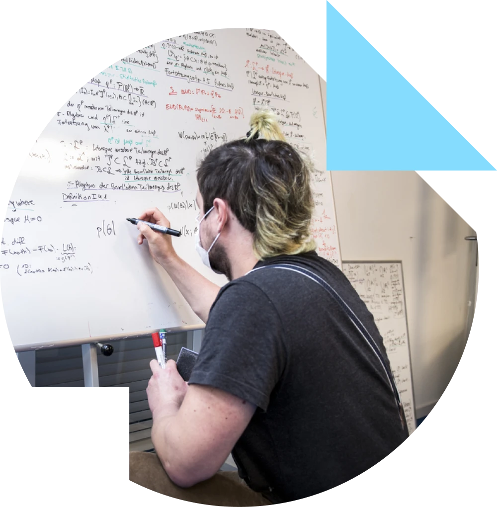 Person writing on a whiteboard