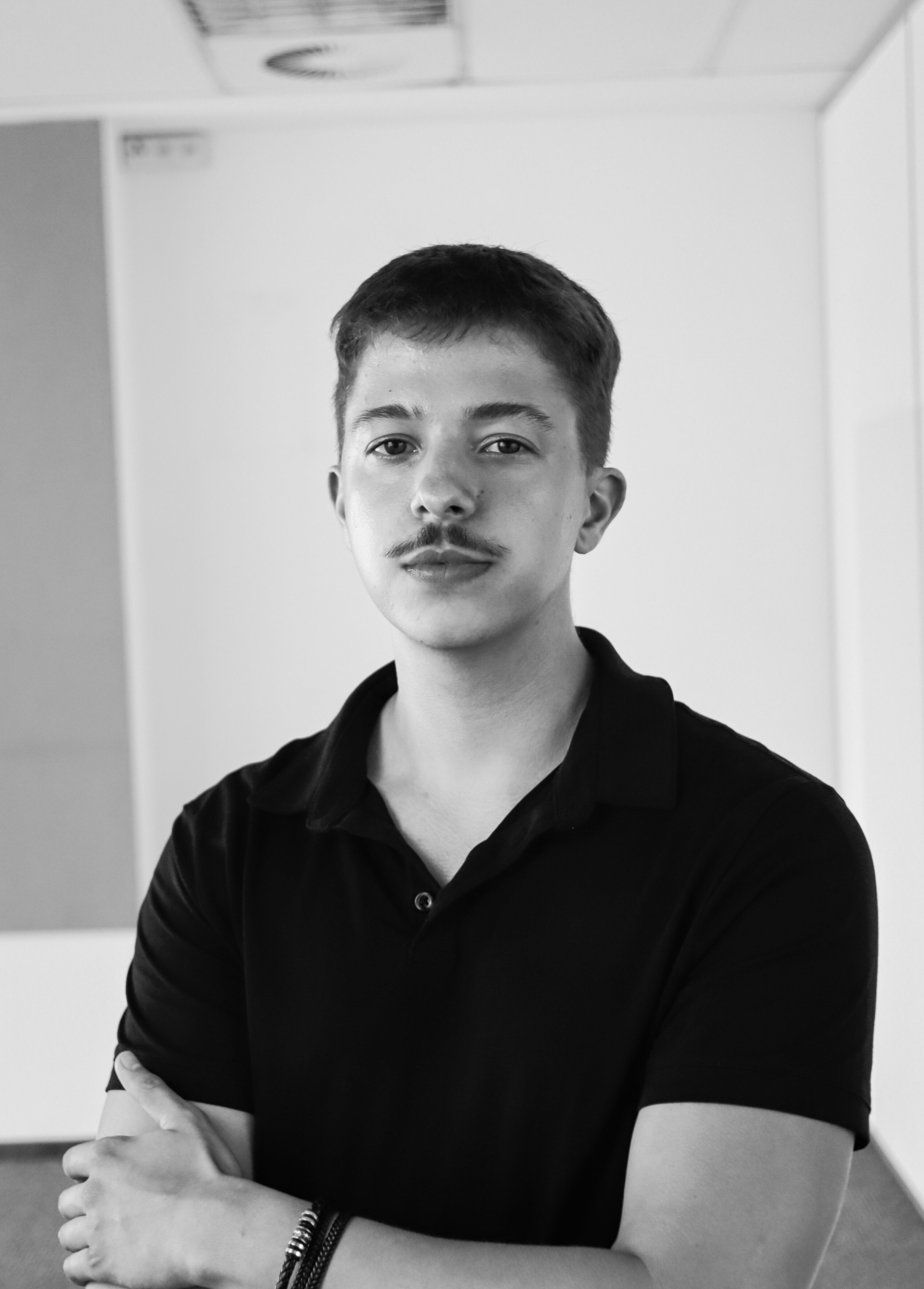 a blurry photo of a person standing in front of a wall