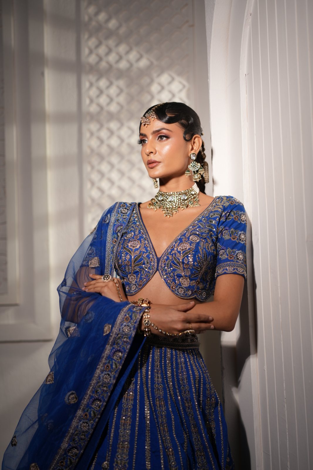 Creating a look where heritage meets modern artistry — sleek, sculpted hair with a touch of traditional jewels