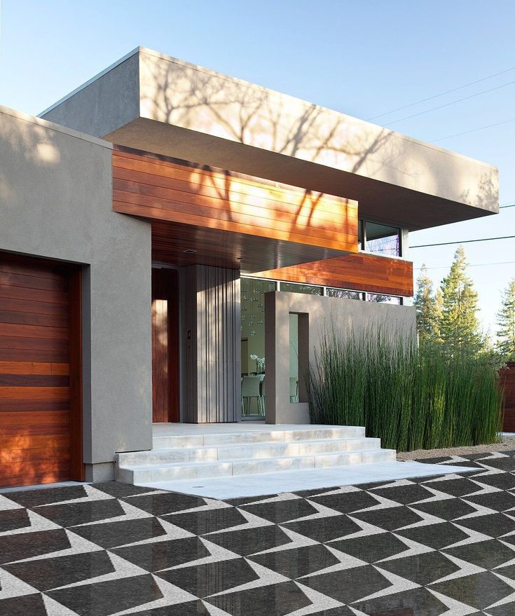 Qube stone paving applied in modern residential entrance with structured patterned driveway design