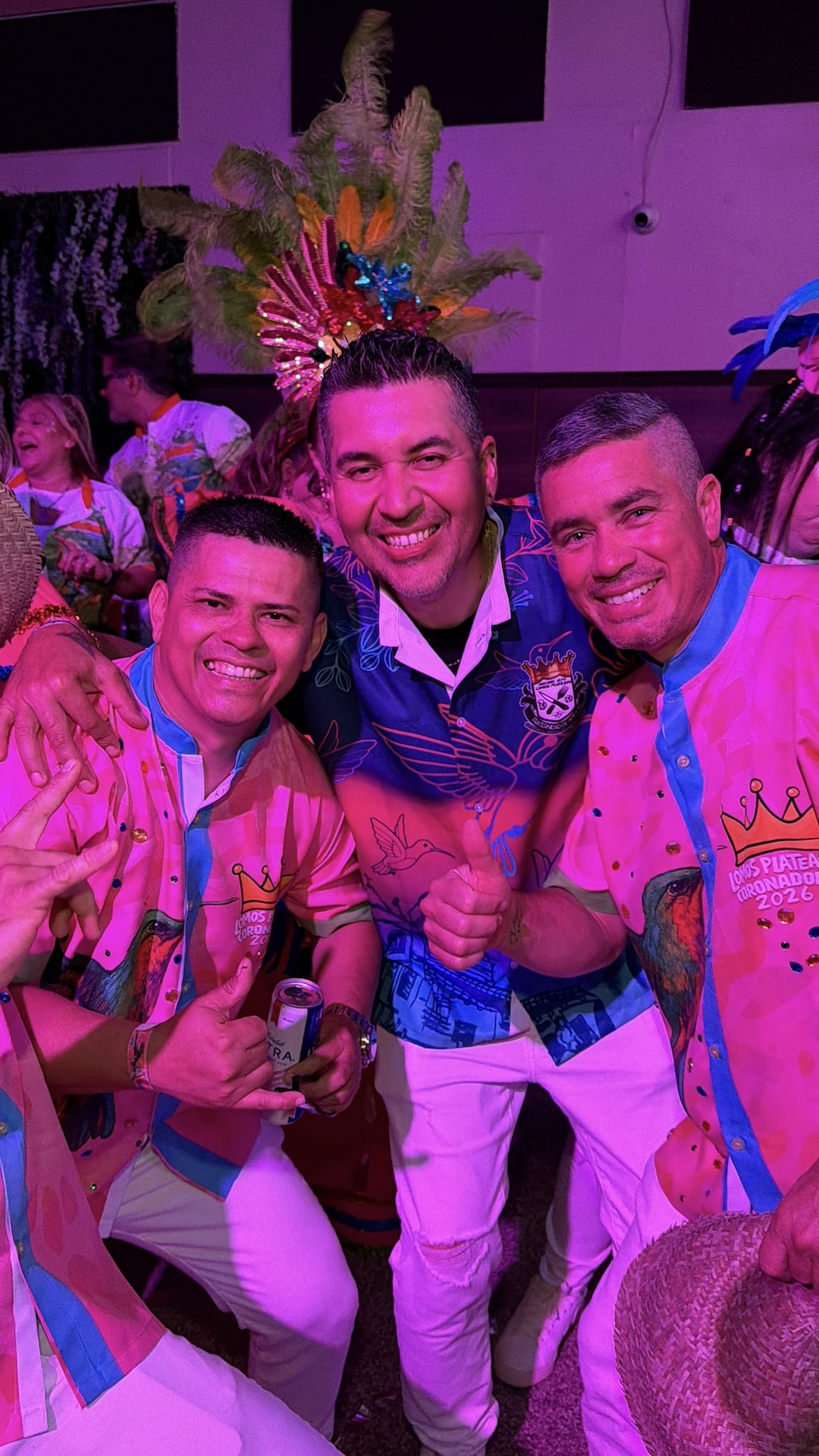 Couple sitting with hot air balloons at sunset