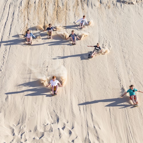 Nothing beats the thrill of sliding down the largest moving sand mass in the southern hemisphere.