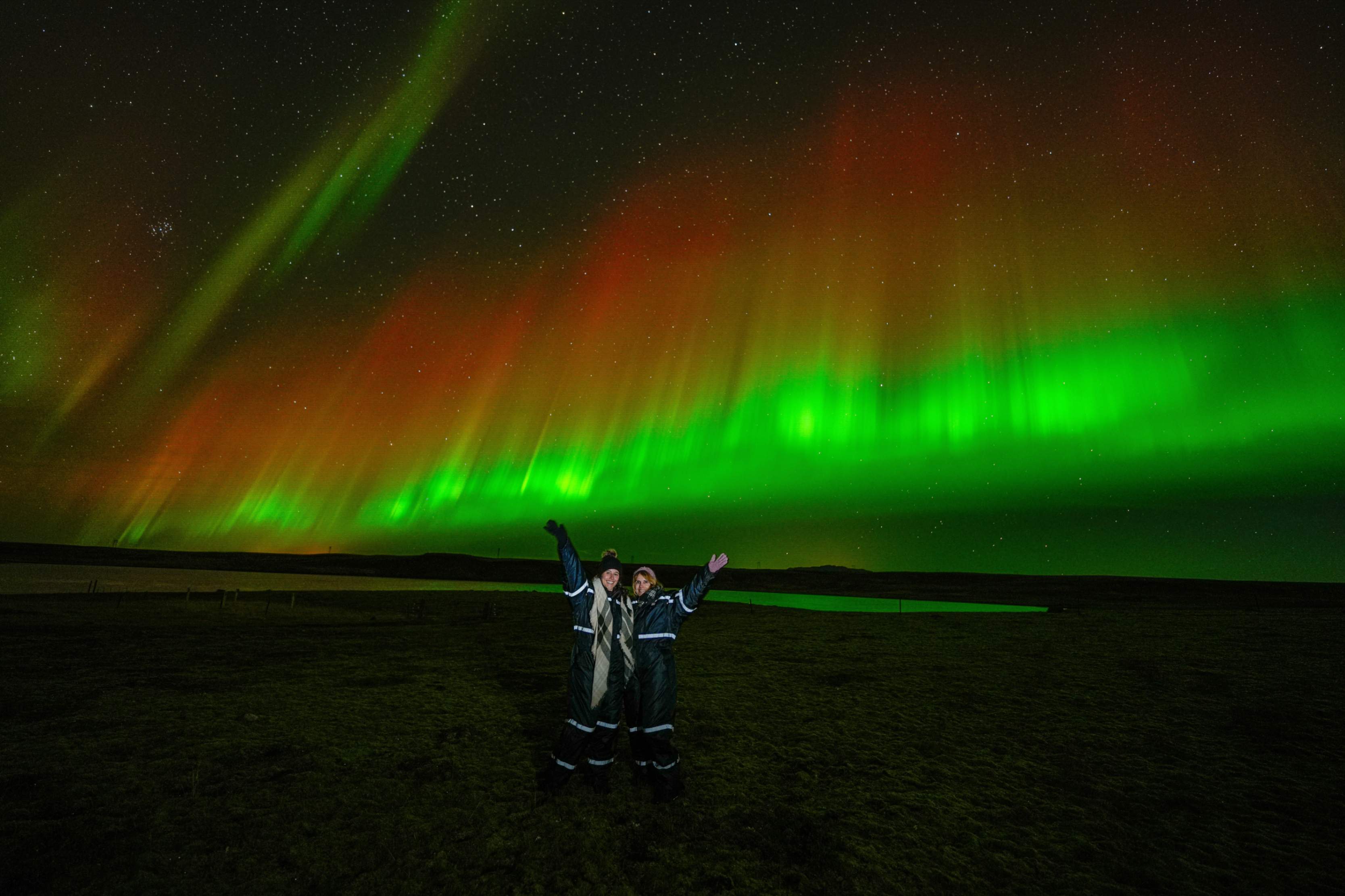 Northern Lights tour photography from Aurora Experts in Iceland, featuring guests beneath the aurora, winter landscapes, and vivid skies over remote Icelandic locations.