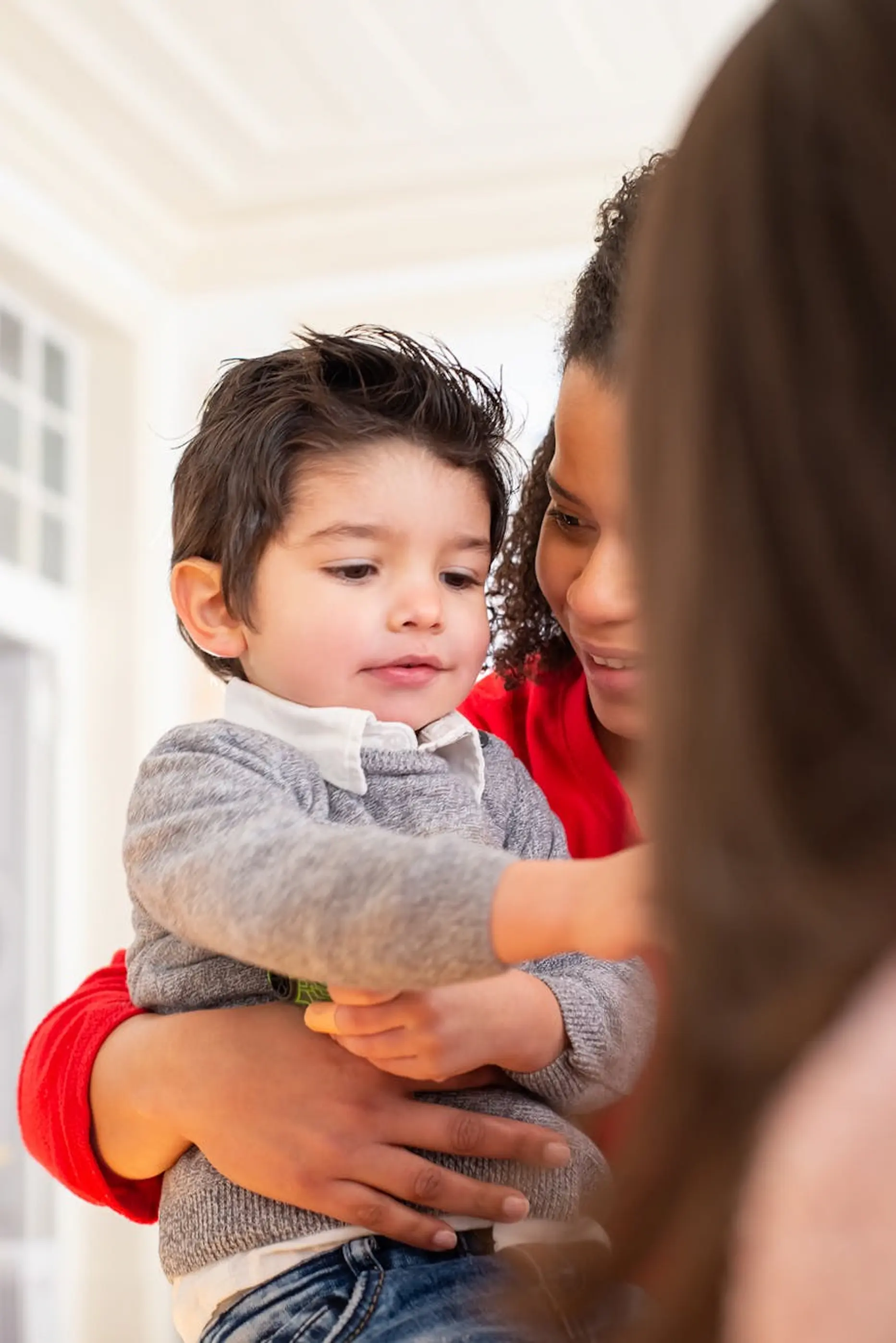 Parent showing ID at preschool pickup — secure child release policy
