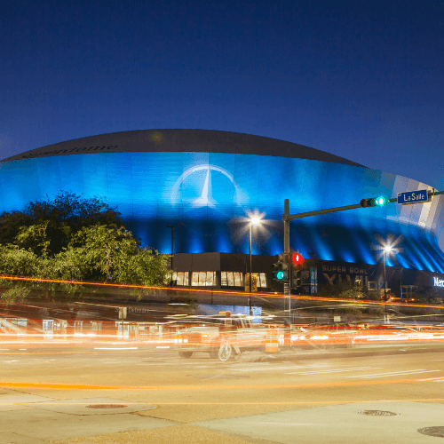 man holding brown football ball