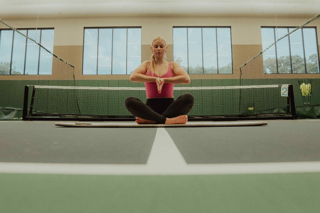 woman in yoga position - Flexibility Routine