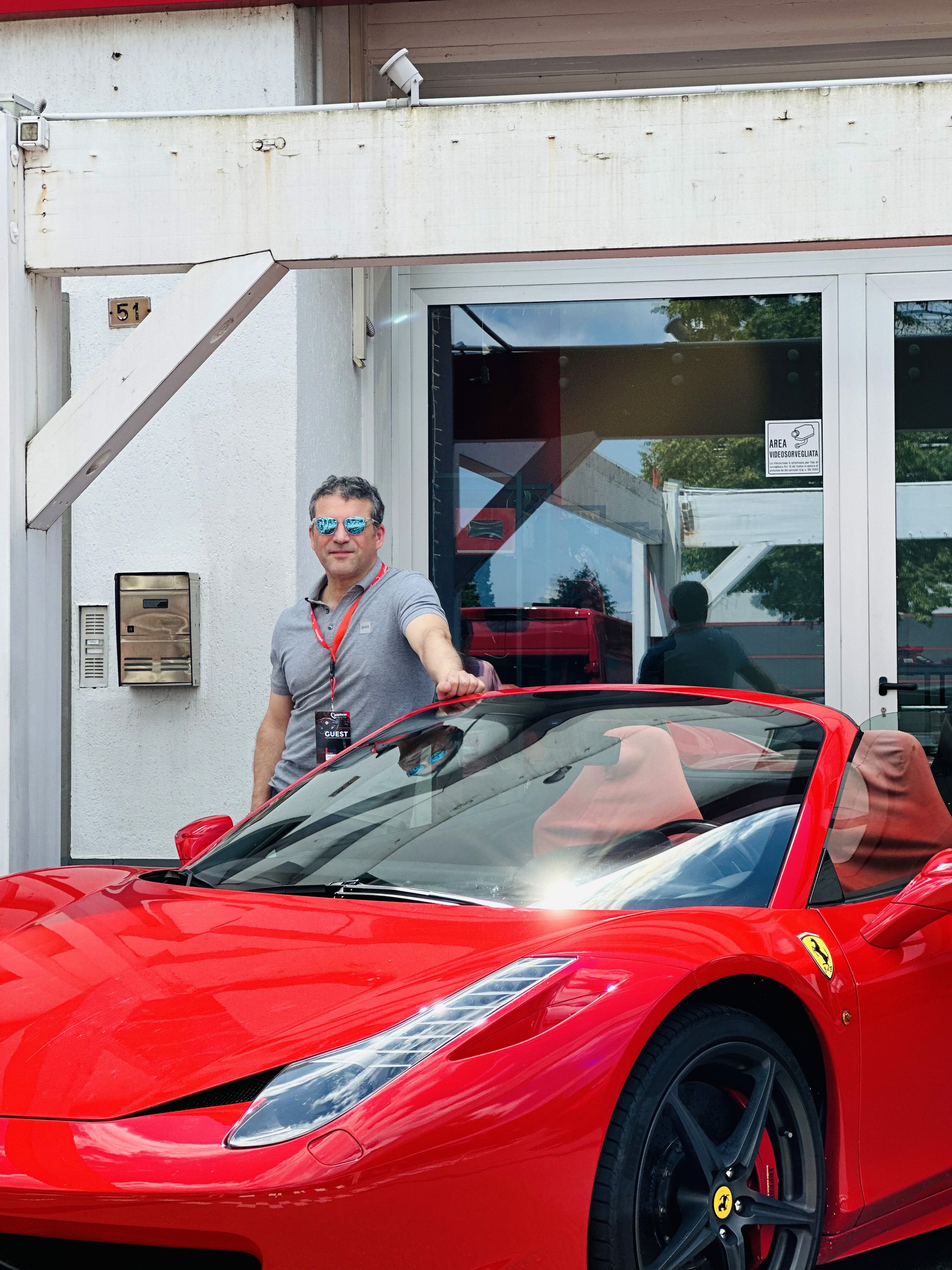 A cell phone sitting on top of a wooden table next to a keyboard