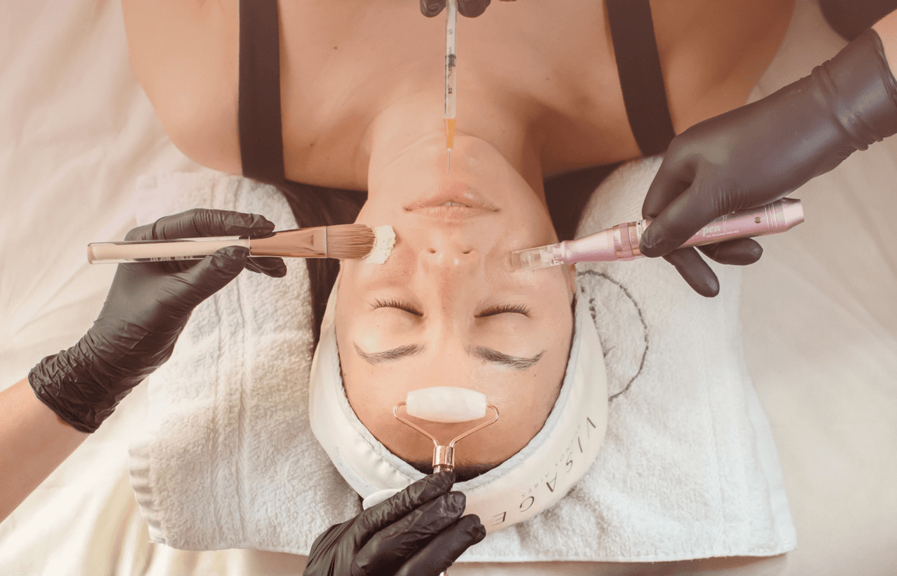 A close-up of a serene face illuminated by soft light, with shadows creating a patterned effect across the skin.