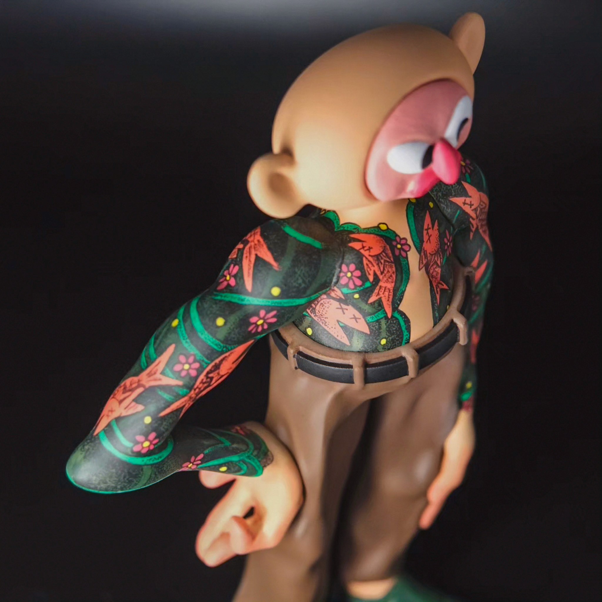 Three-quarter close-up of Tattooman showing the tattoo-inspired upper body graphics.