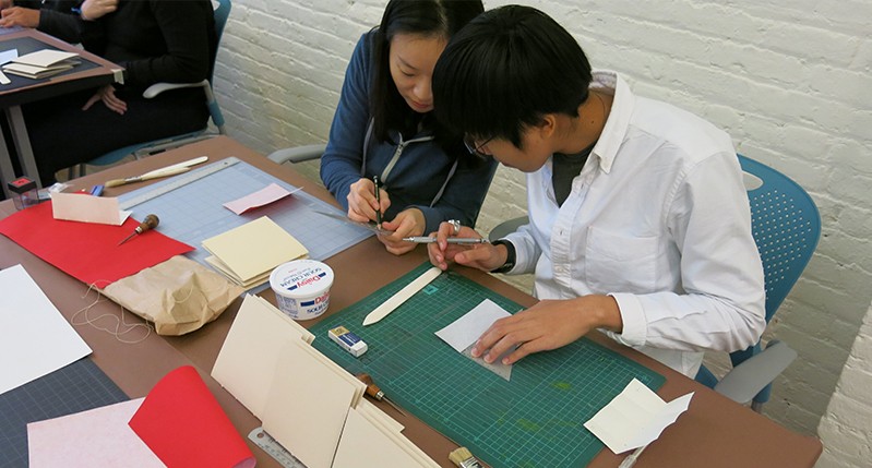 students working with materials and tools in the course class