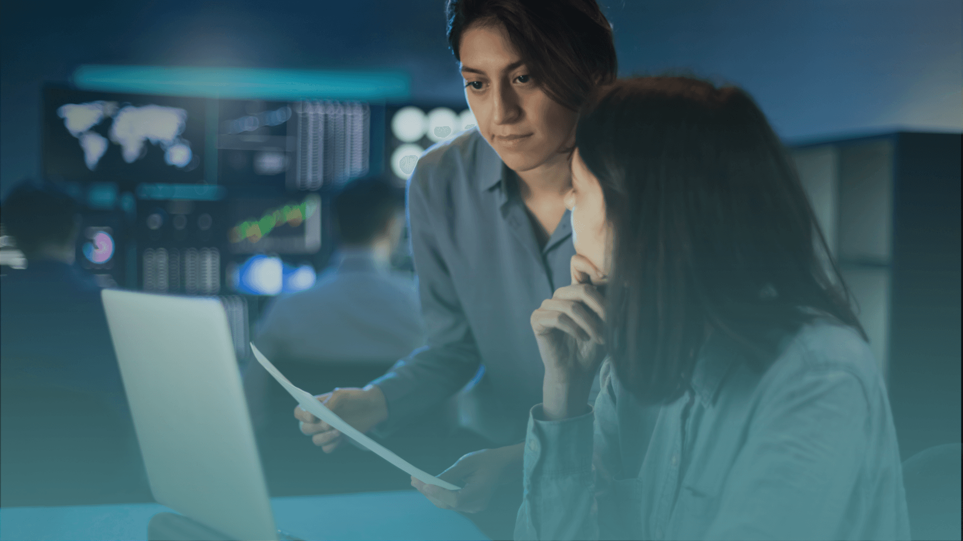 man sitting beside woman looking at a contract on DocuSign