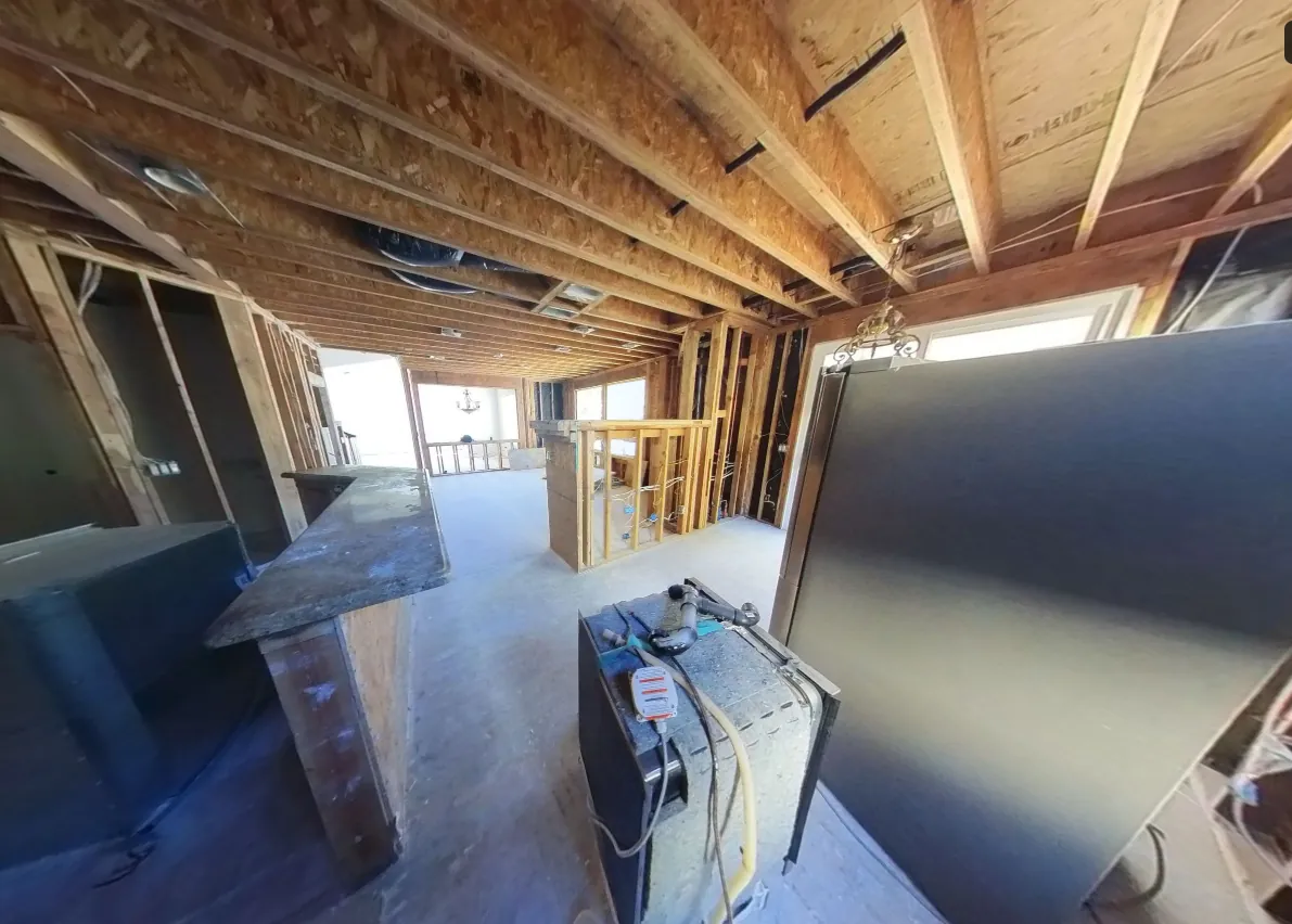 Walls opened to framing for drying during an ERC water damage job