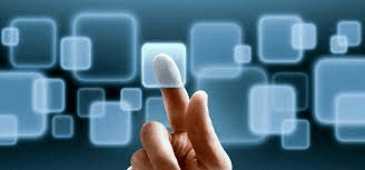 a cell phone sitting on top of a laptop computer