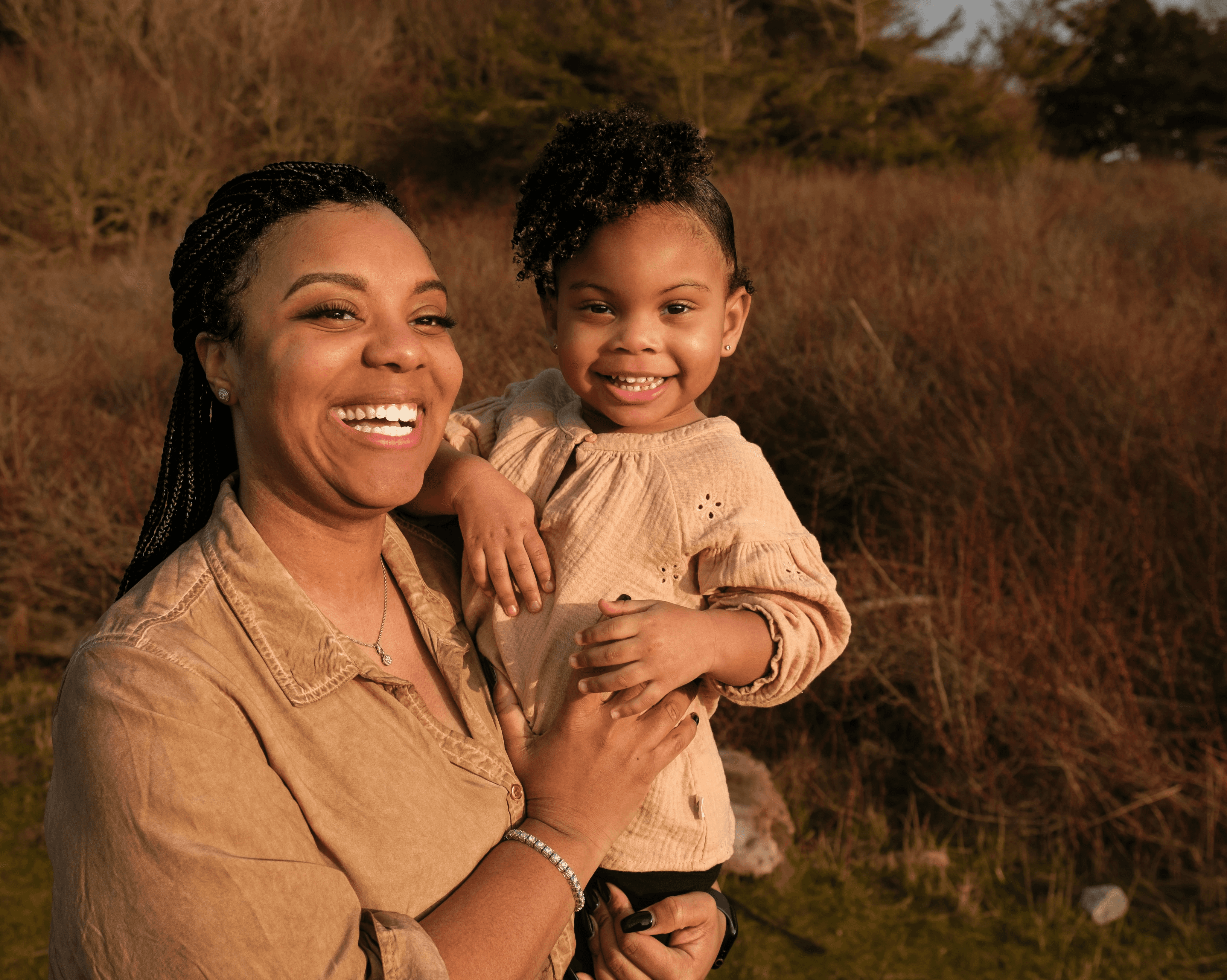 a woman holding a small child in her arms