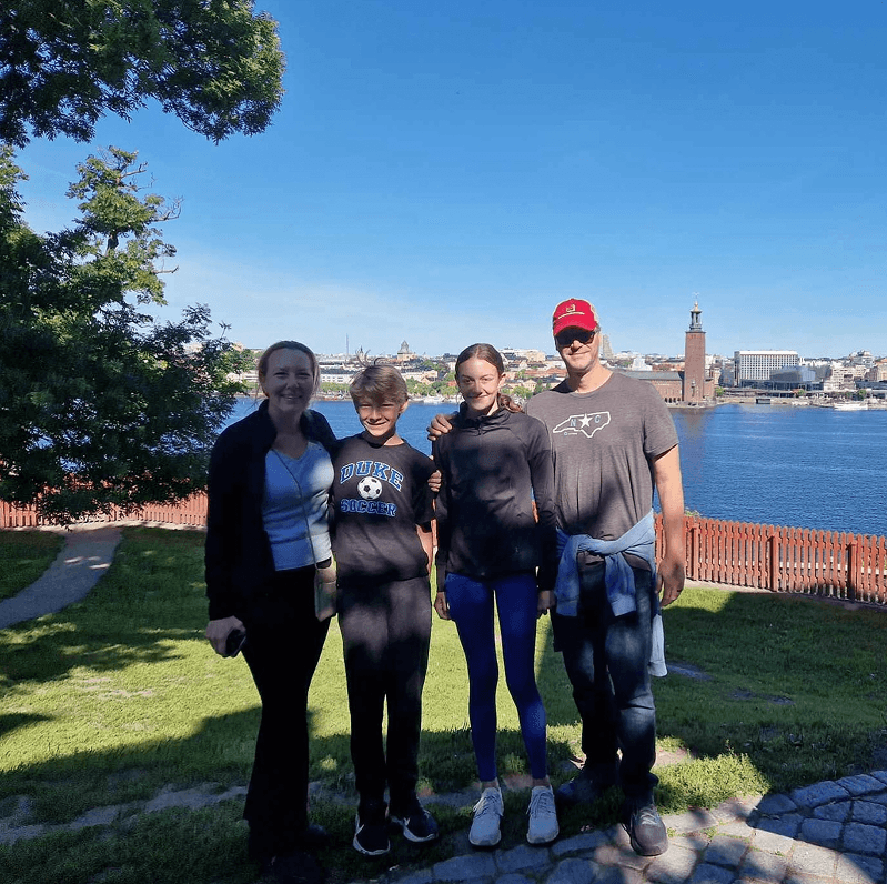 Tourists exploring Stockholm during private electric sightseeing cart tour