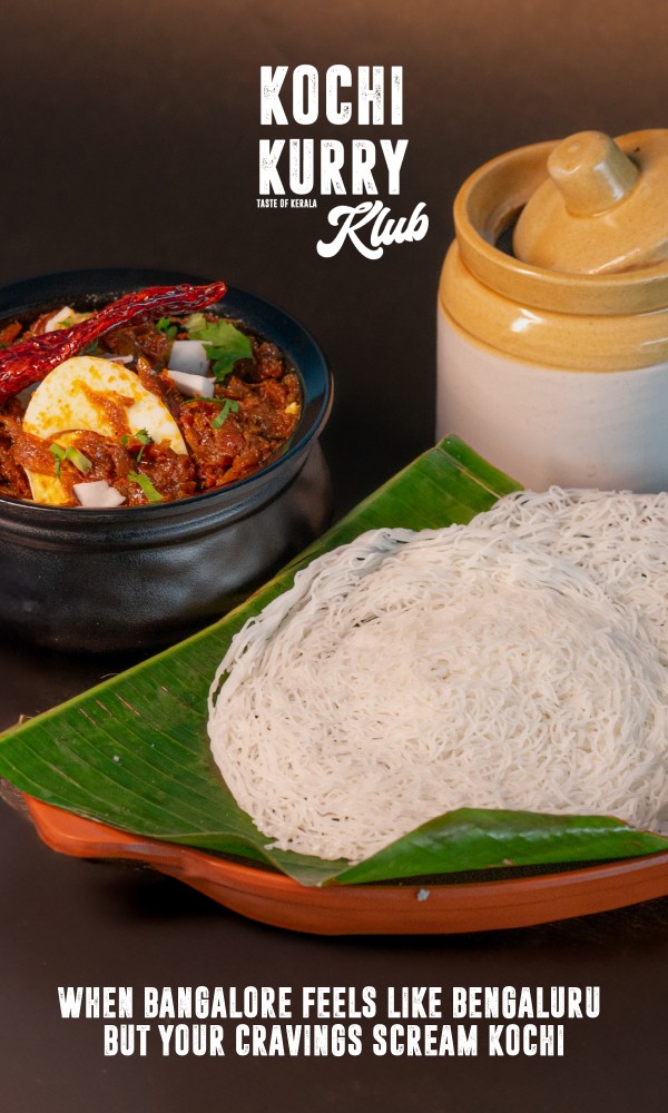 Traditional Kerala meal with appam, spicy chicken curry, and a clay pot of coconut chutney from Kochi Kurry Klub.