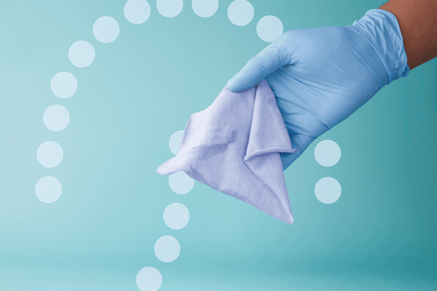 Sanitary wipe held in hand with Net32 logo background.