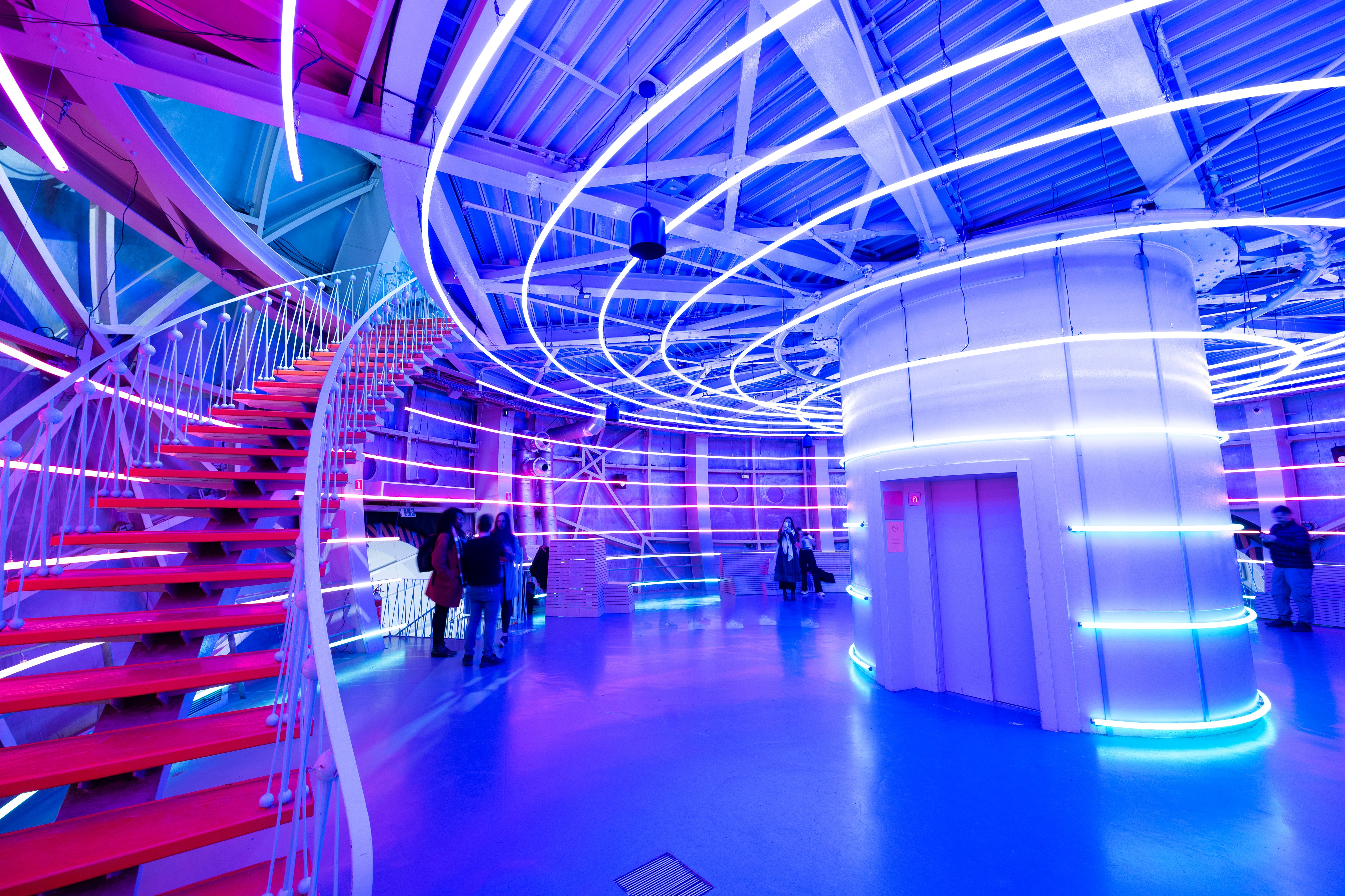 Visitors experiencing Centrale, the Visual System immersive light artwork at Atomium, Brussels