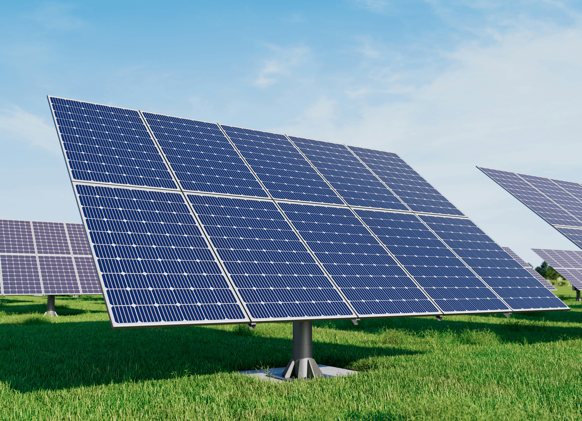 Solar panels array in a green field under blue sky
