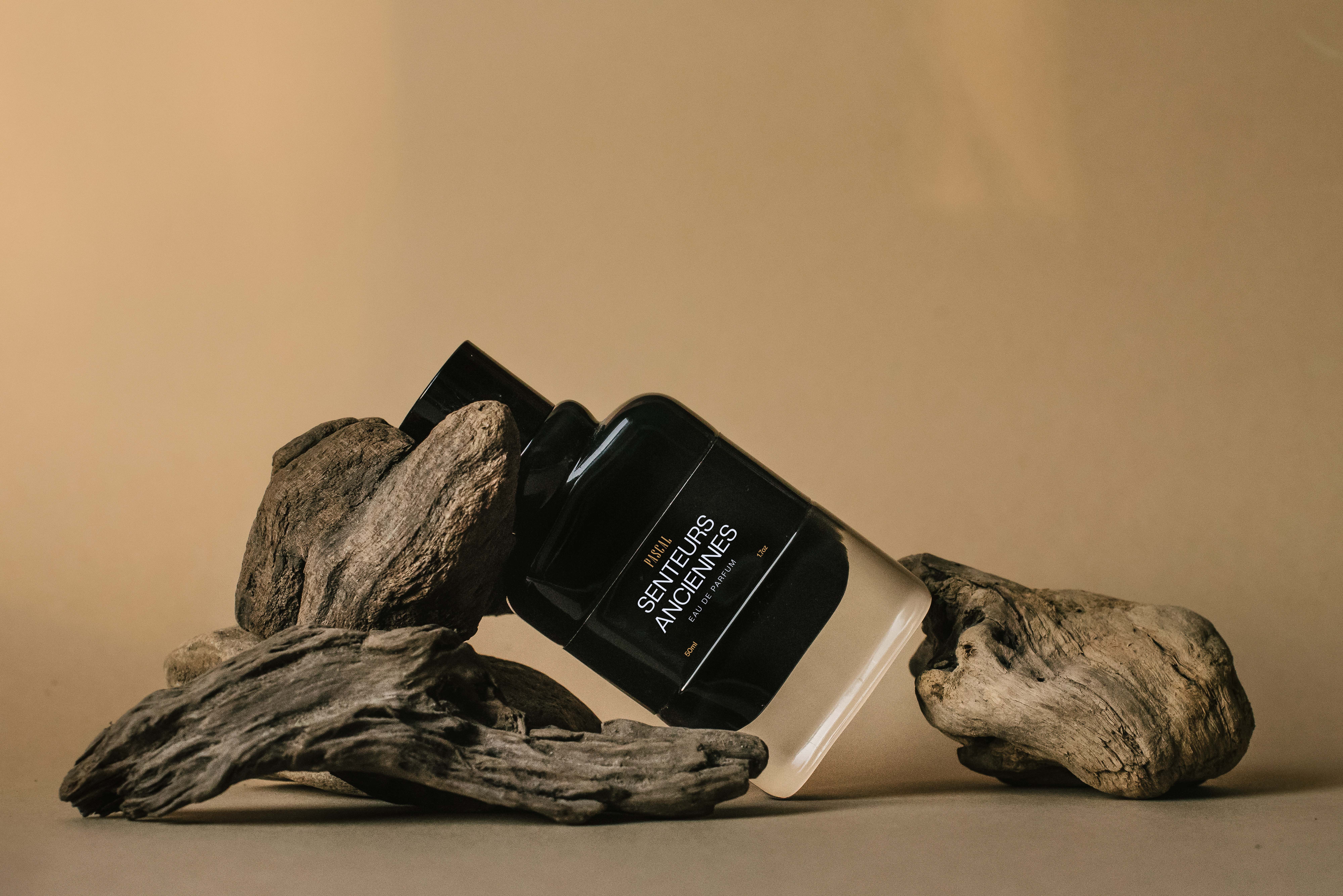 Cosmetic Company Design Case Study, Pascal Cosmetics, Pascal Fragrances, Fragrance Placed At An Angle On Old Wood