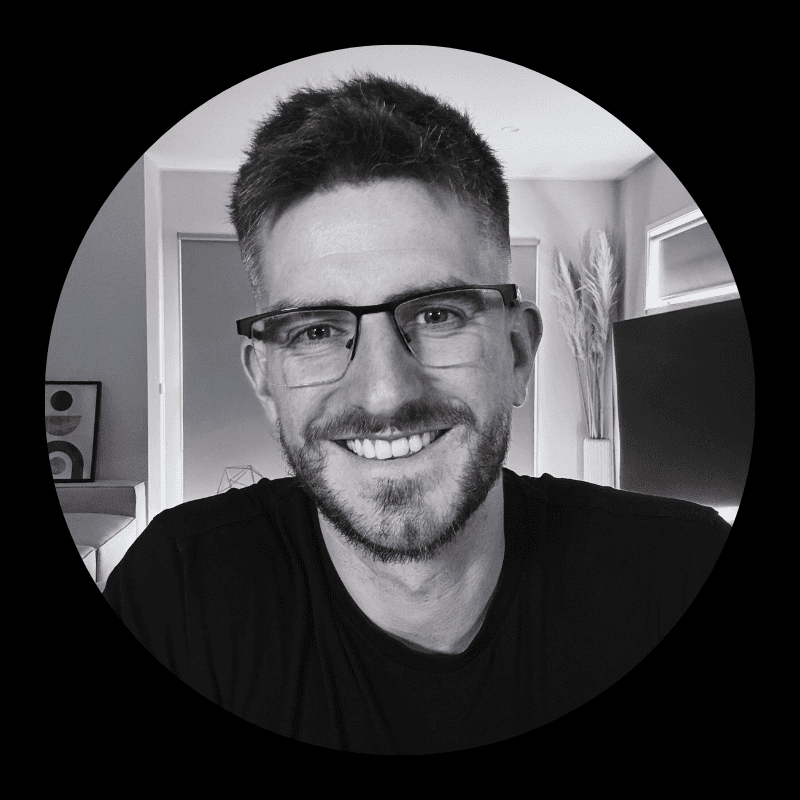 man in black crew neck shirt wearing black hat